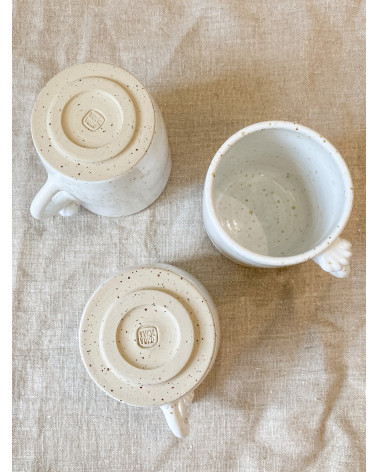 Handmade stoneware mug with seashell