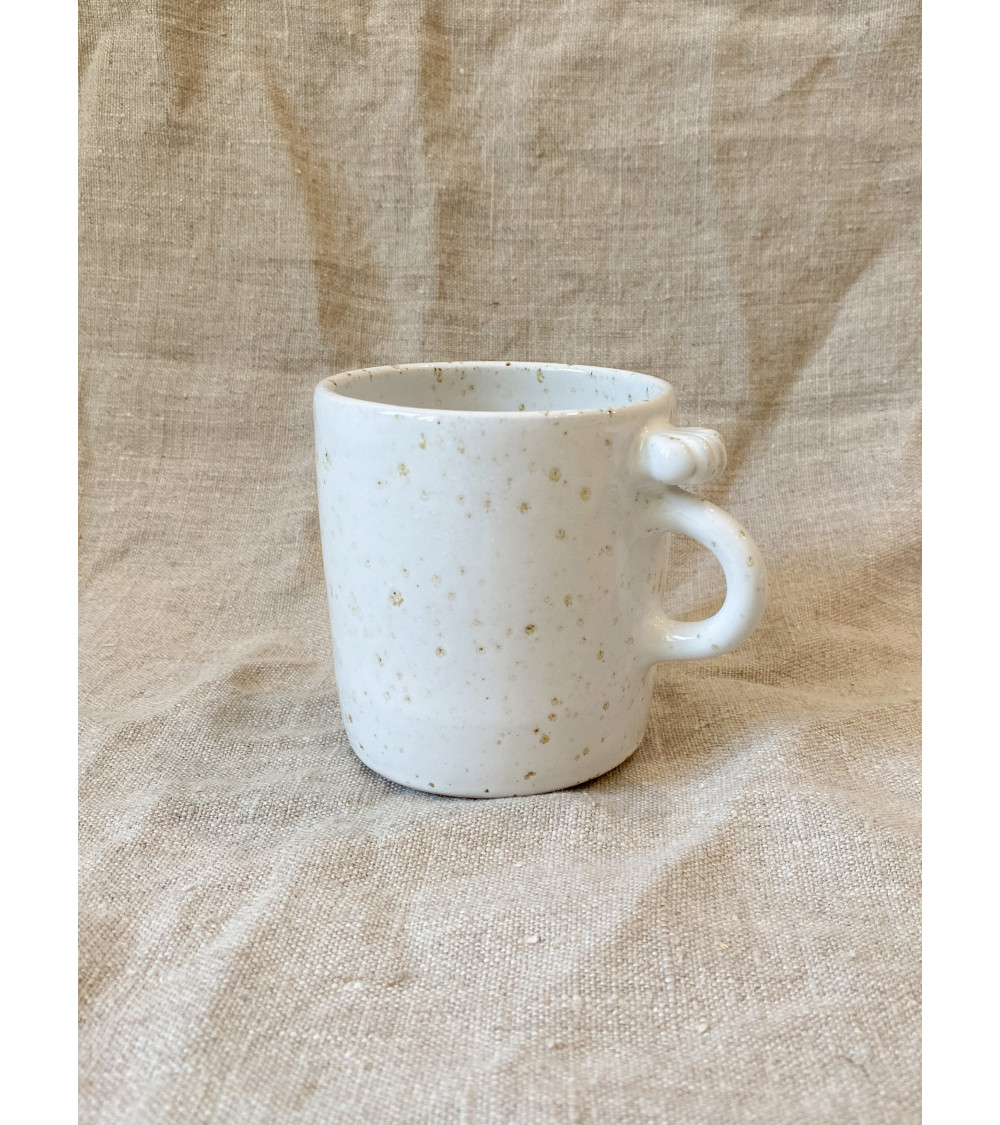 Handmade stoneware mug with seashell