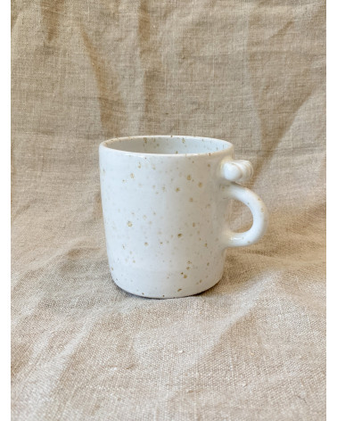 Handmade stoneware mug with seashell
