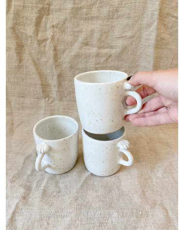 Handmade stoneware mug with seashell