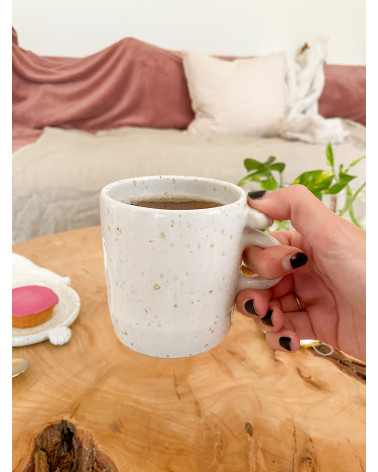 Handmade stoneware mug with seashell