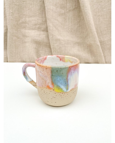 Handmade artisanal ceramic rainbow beach cup