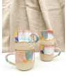 Handmade artisanal ceramic rainbow beach cup