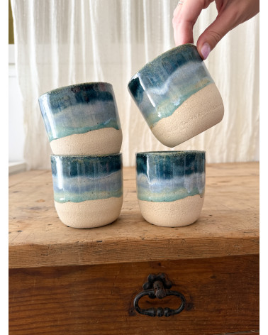 Handmade artisanal ceramic rainbow beach cup