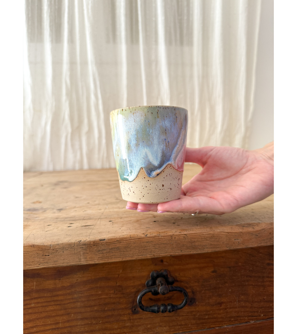 Handmade artisanal ceramic rainbow cup