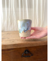 Handmade artisanal ceramic rainbow cup