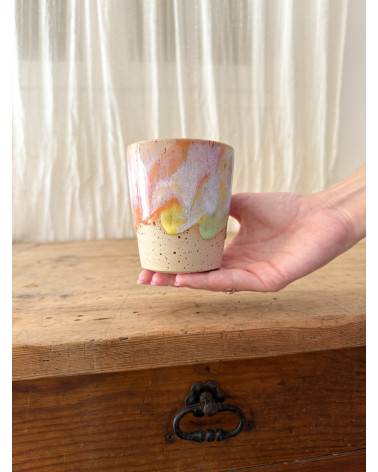 Handmade artisanal ceramic rainbow cup