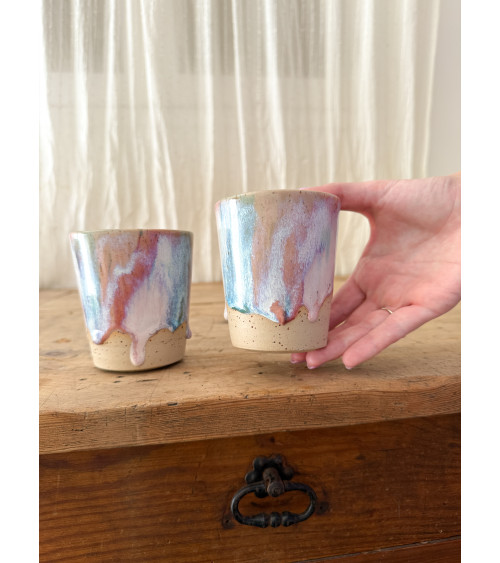 Handmade artisanal ceramic turquoise and pink cup