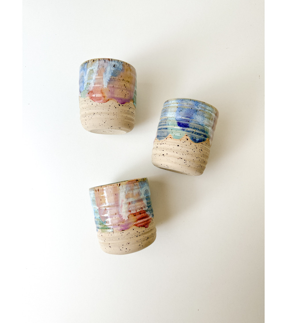 Handmade artisanal ceramic purple cup