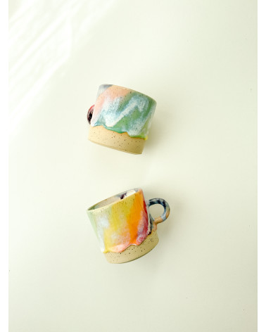 Handmade artisanal ceramic rainbow beach cup