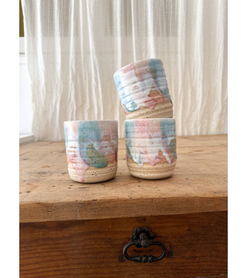 Handmade artisanal ceramic turquoise and pink cup