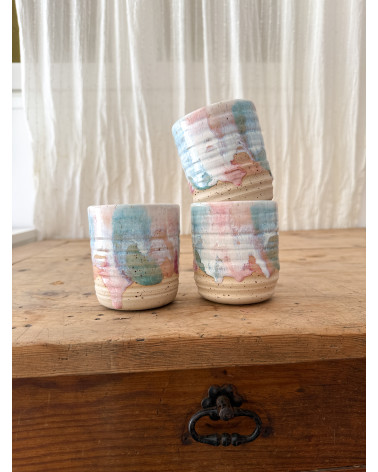 Handmade artisanal ceramic turquoise and pink cup