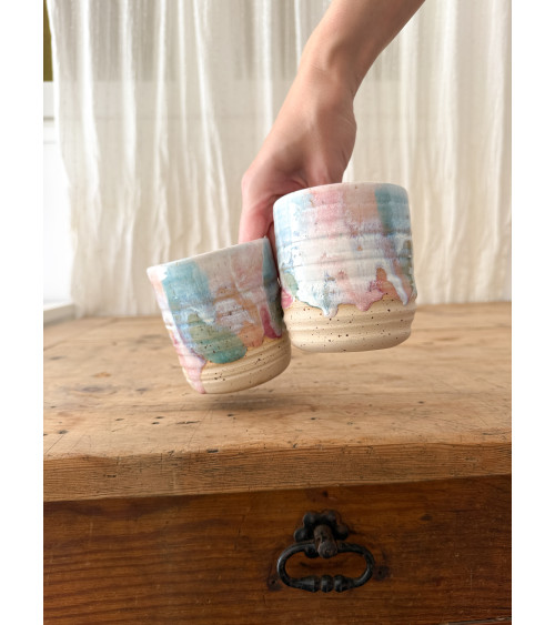 Handmade artisanal ceramic turquoise and pink cup