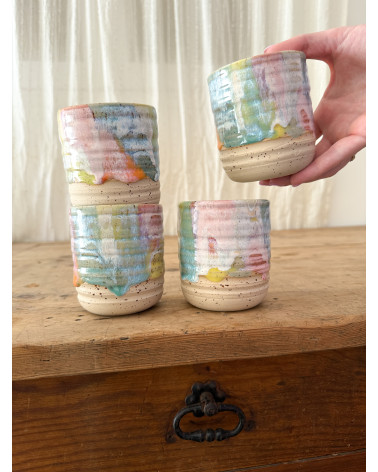Handmade artisanal ceramic rainbow cup