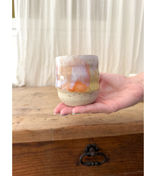 Handmade artisanal ceramic rainbow cup